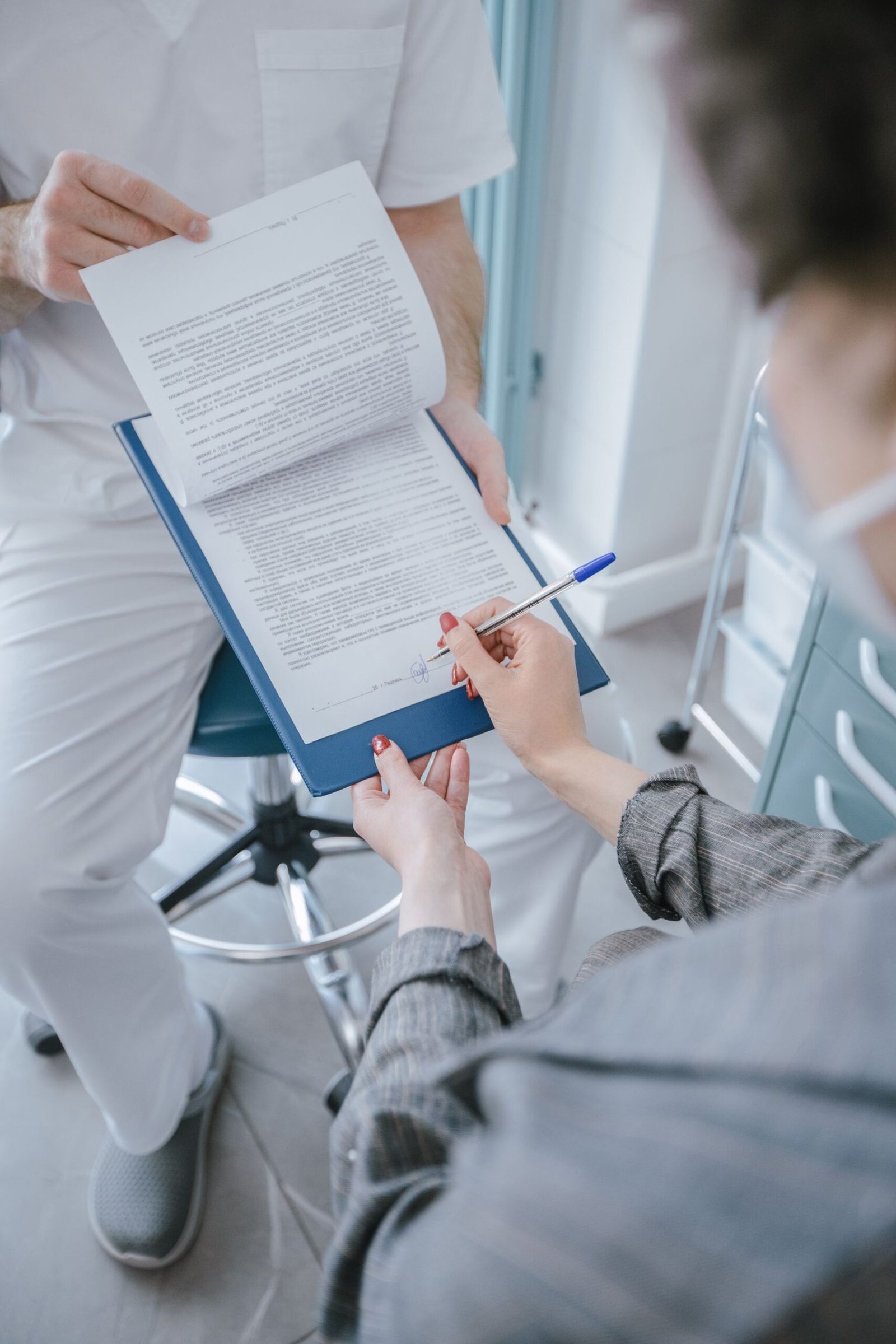 Close-up of healthcare paperwork being completed