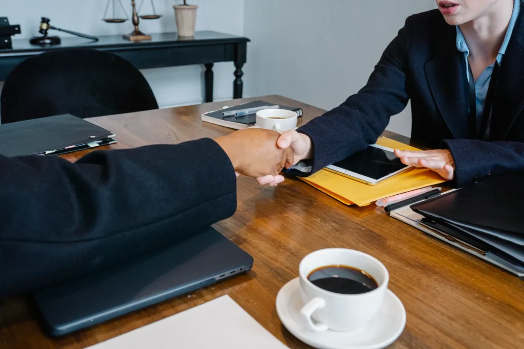 Folders, coffee and working materials on a business meeting table